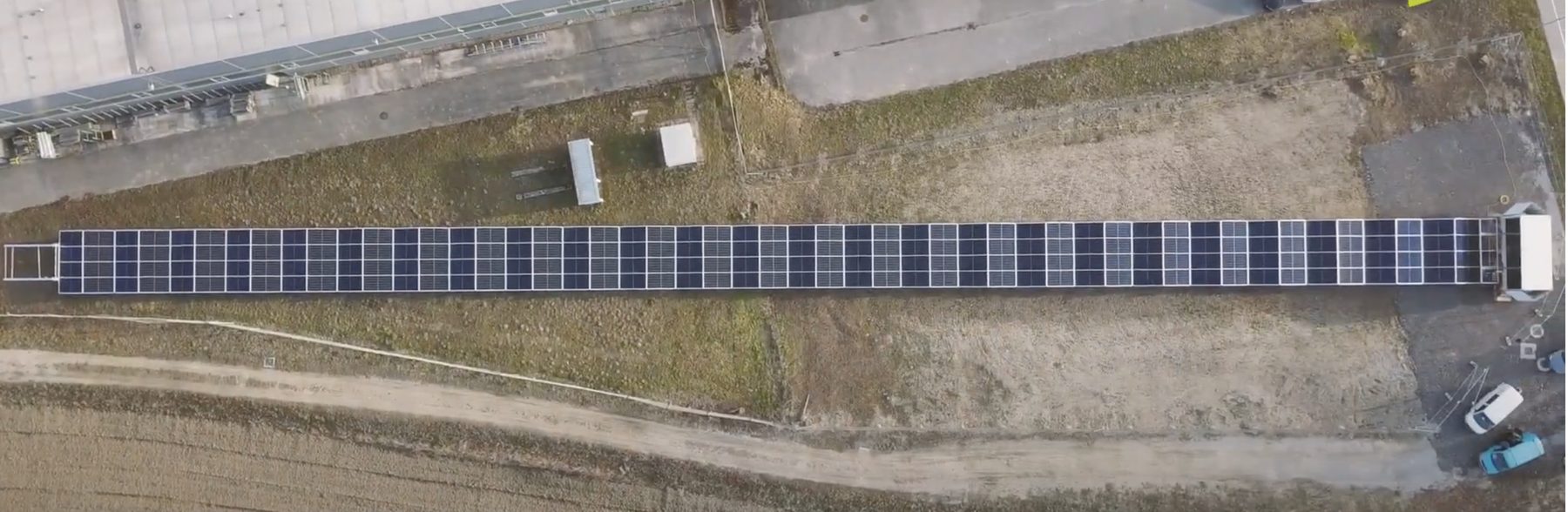 Containerized folding solar array prototype, fully deployed — drone view